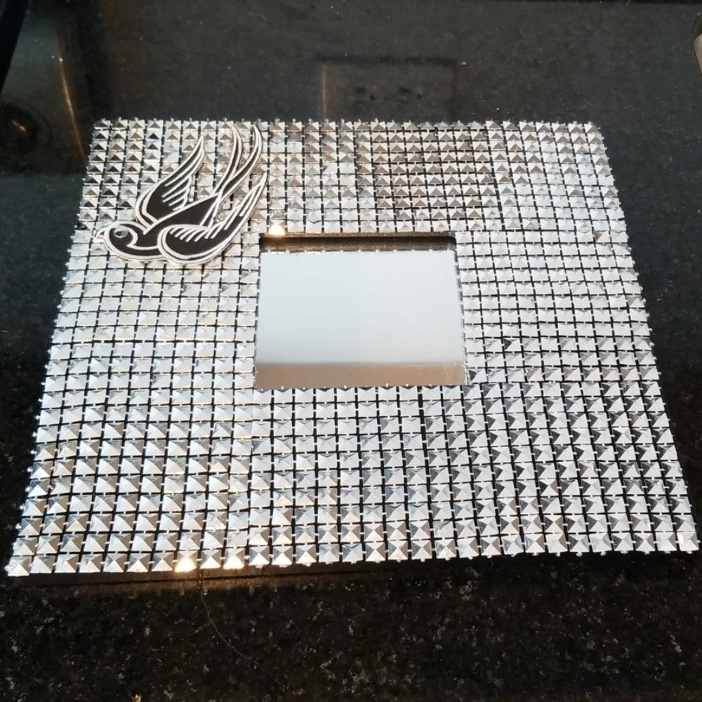 Modern studded wall mirror